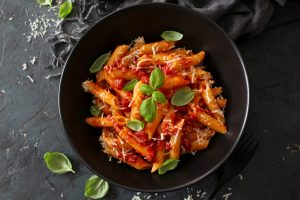 Penne,Pasta,With,Tomato,Sauce,,Parmesan,Cheese,And,Basil