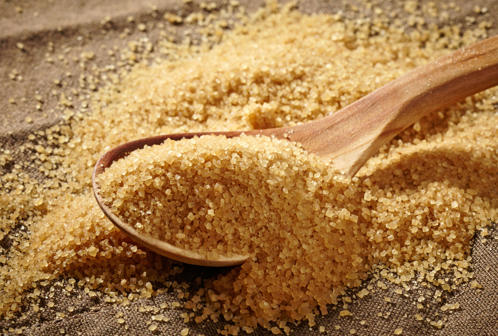 Raw sugar on spoon