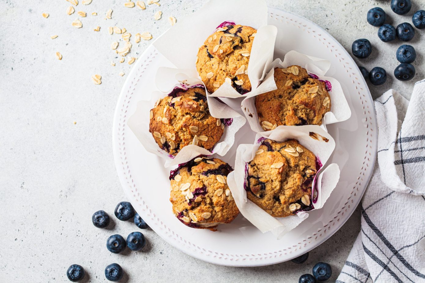 Peanut granola and blueberry muffins on plate