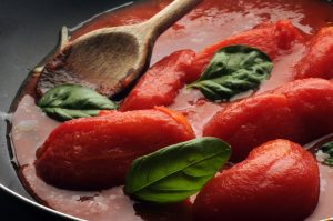 Italian pomodoro peeled tomatoes in casserole dish.